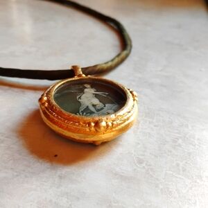 Reprotique Fob, Venus in BrownThis handcrafted medallion necklace uses imagery